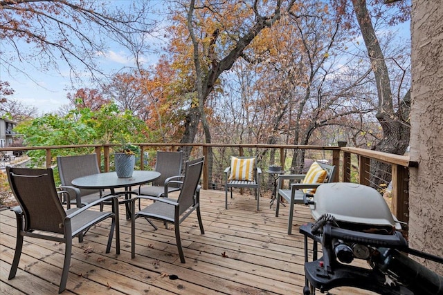 wooden deck featuring area for grilling