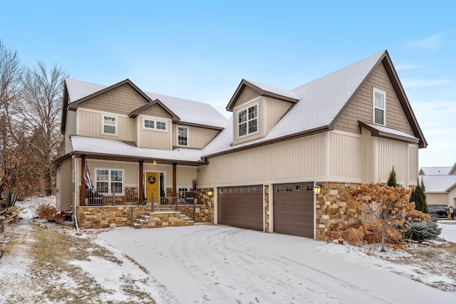 view of front of home featuring a porch and a garage