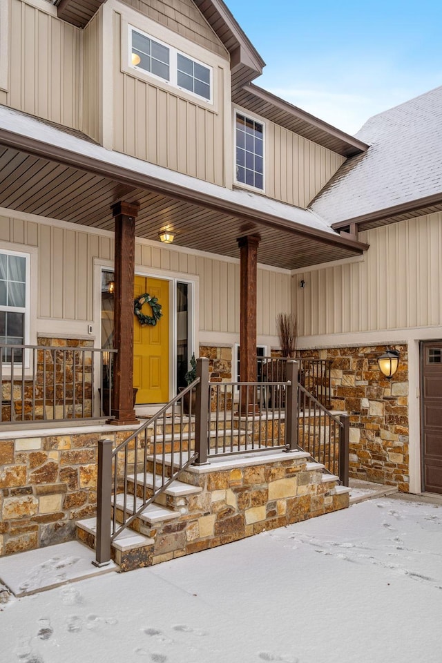 view of exterior entry featuring a porch