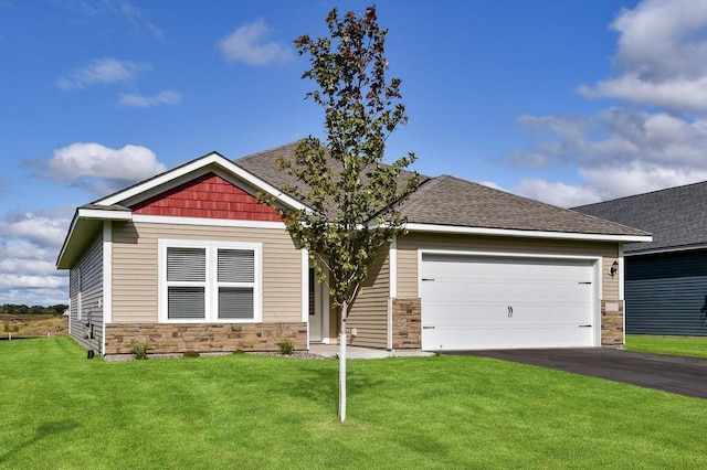 craftsman-style home featuring a garage and a front lawn