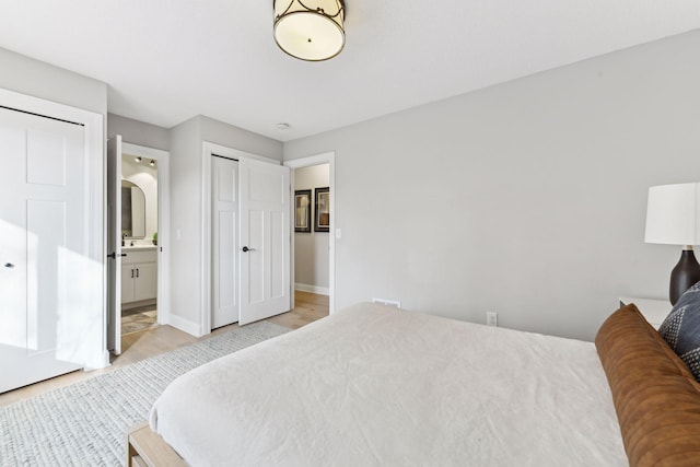 bedroom featuring ensuite bath