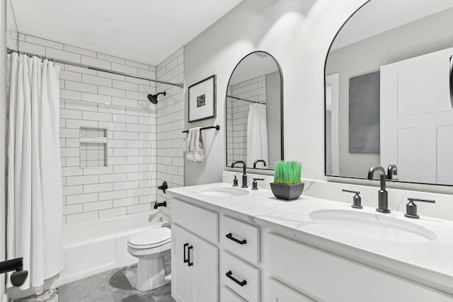 full bathroom featuring vanity, shower / tub combo, and toilet