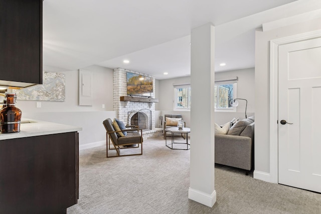 carpeted living room featuring a brick fireplace