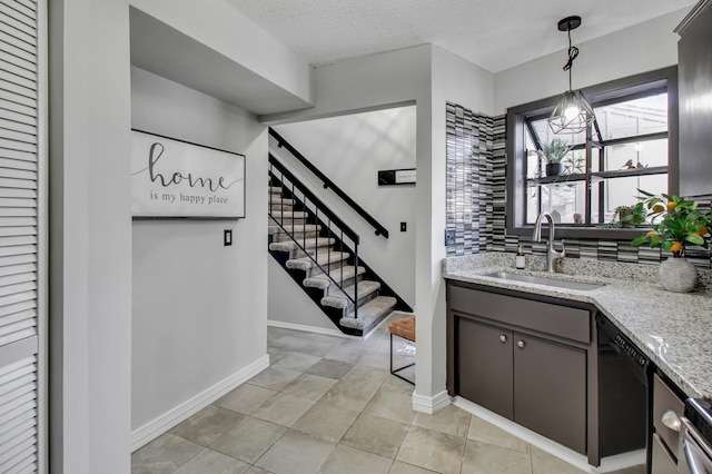 bar with a sink, black dishwasher, stairway, tasteful backsplash, and decorative light fixtures