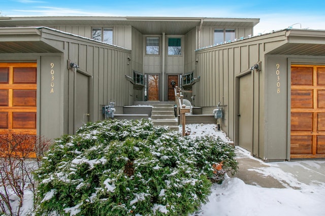 exterior space with an attached garage and board and batten siding