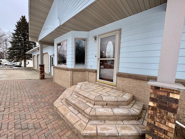 property entrance with a garage