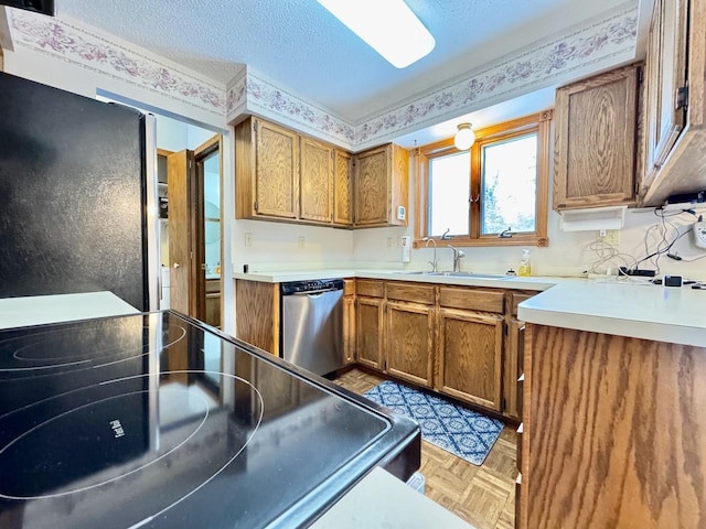 kitchen with dishwasher, refrigerator, sink, range, and light parquet flooring