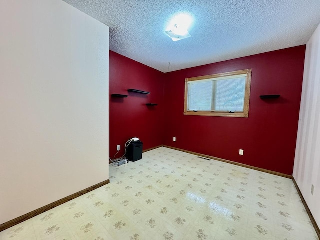 interior space featuring a textured ceiling