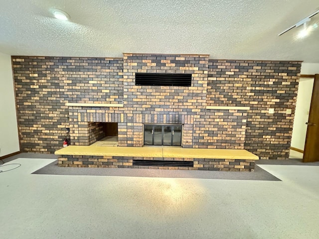 unfurnished living room featuring a textured ceiling