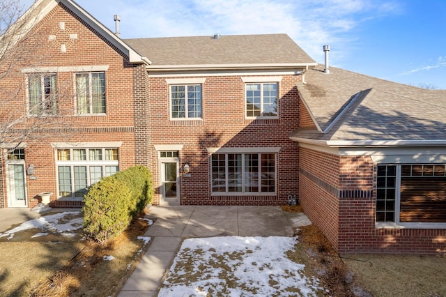 back of house with a patio