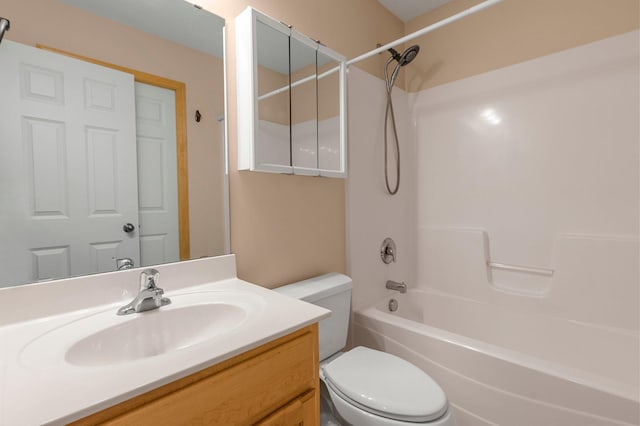 bathroom featuring shower / bathing tub combination, vanity, and toilet