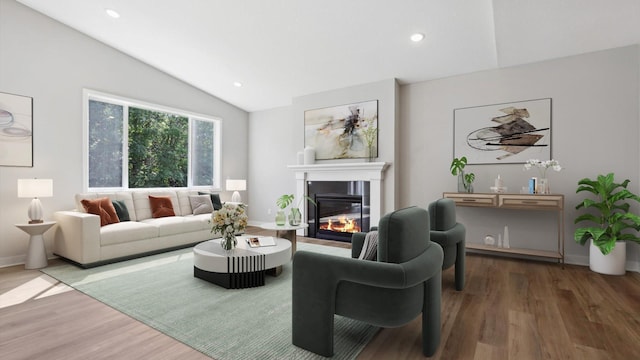 living room with hardwood / wood-style floors and lofted ceiling