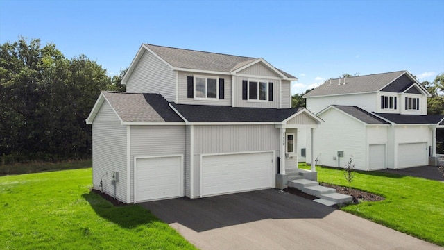 view of property with a garage and a front yard