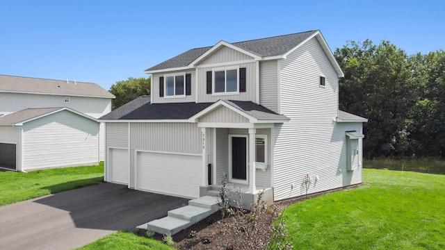 view of front of house featuring a garage and a front lawn