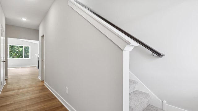 hallway with light hardwood / wood-style flooring