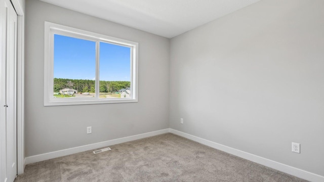 view of carpeted spare room