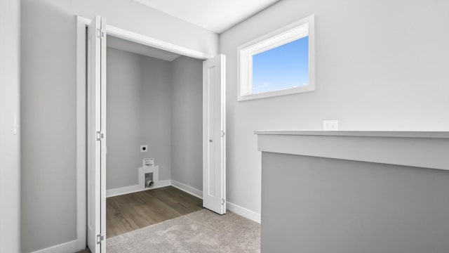 interior space with light carpet and electric dryer hookup