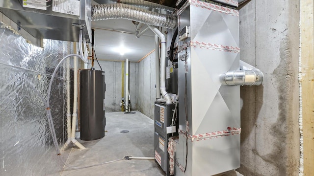 utility room featuring heating unit and electric water heater