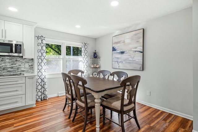 dining space with light wood-type flooring