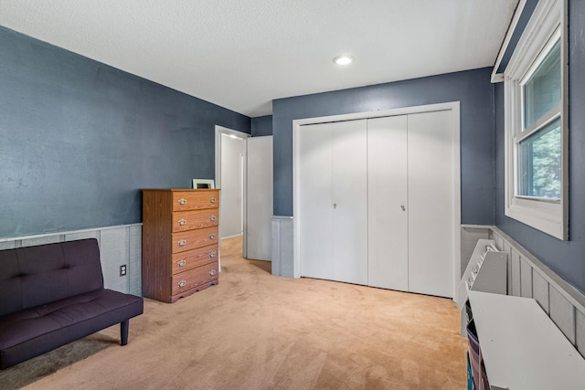 sitting room with light colored carpet