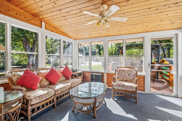 sunroom / solarium with wood ceiling, vaulted ceiling, and ceiling fan