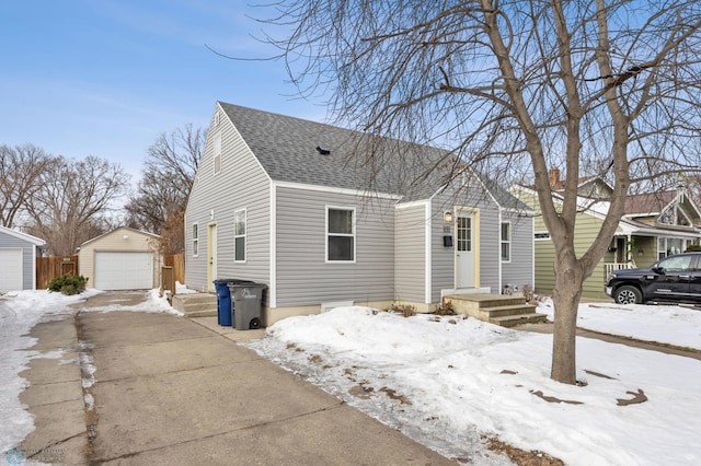 bungalow-style house with an outdoor structure and a garage