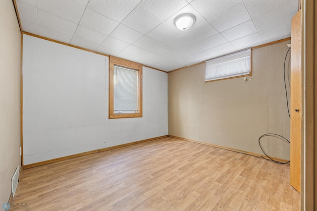 interior space featuring light wood-type flooring and ornamental molding