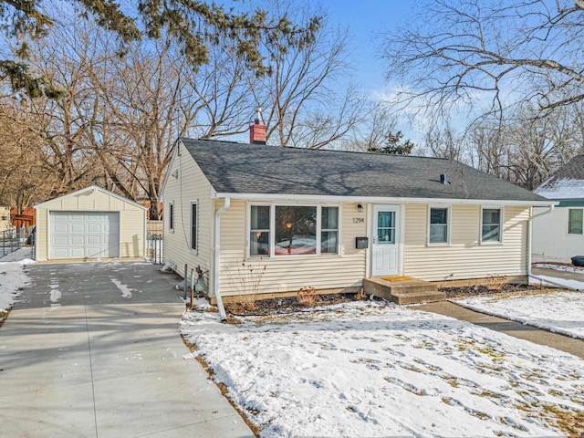 view of front of home featuring an outdoor structure and a garage