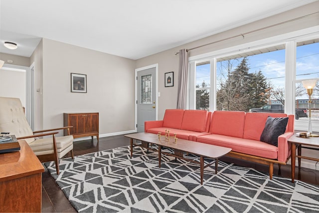 living room with plenty of natural light and dark wood-type flooring