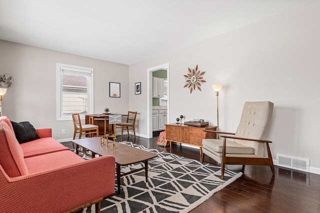 living room with dark hardwood / wood-style floors