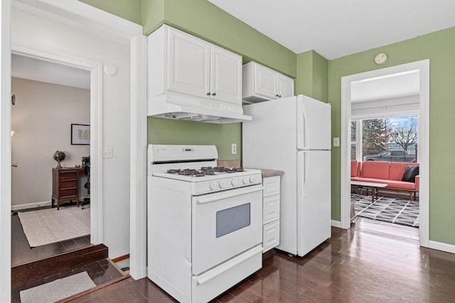 kitchen with white cabinetry, white appliances, and dark hardwood / wood-style floors