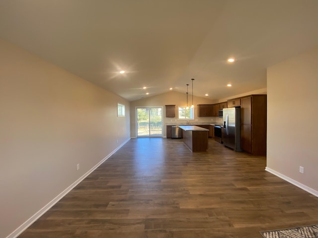 kitchen featuring a center island, hanging light fixtures, dark hardwood / wood-style floors, stainless steel refrigerator with ice dispenser, and lofted ceiling