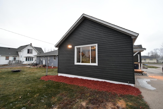 view of home's exterior featuring a yard