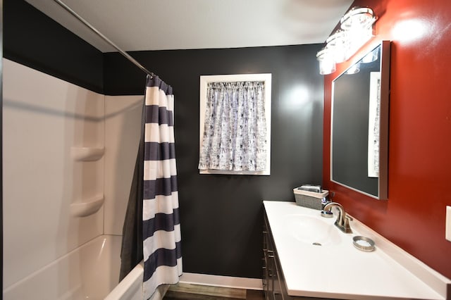 bathroom featuring vanity and shower / bath combo with shower curtain