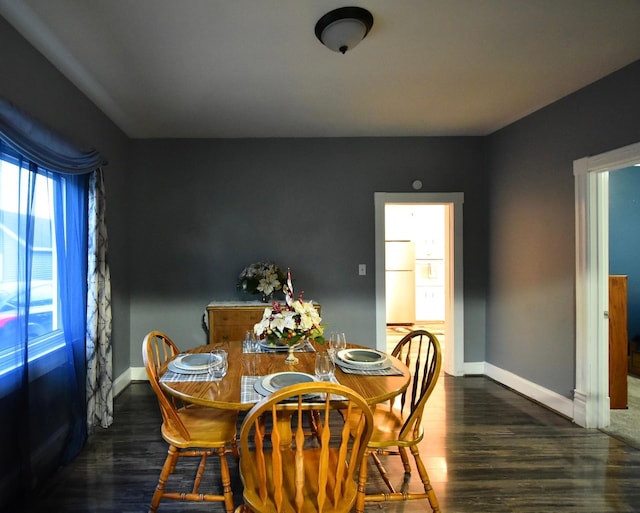 dining space featuring dark hardwood / wood-style floors