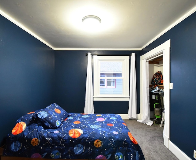 bedroom with ornamental molding and carpet