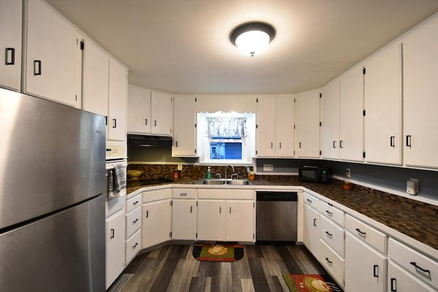 kitchen featuring white cabinetry, stainless steel appliances, dark wood-type flooring, and sink