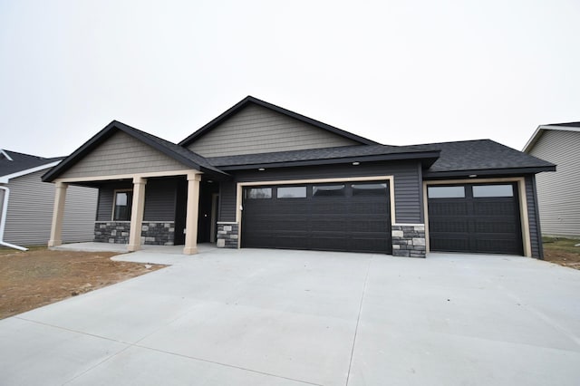 view of front of house featuring a garage and covered porch