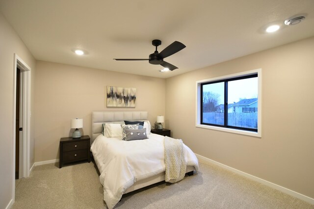 bedroom featuring ceiling fan and light colored carpet