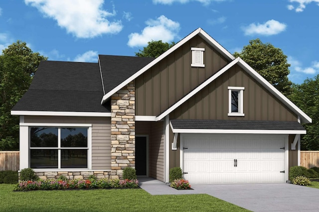 view of front facade with a front yard and a garage