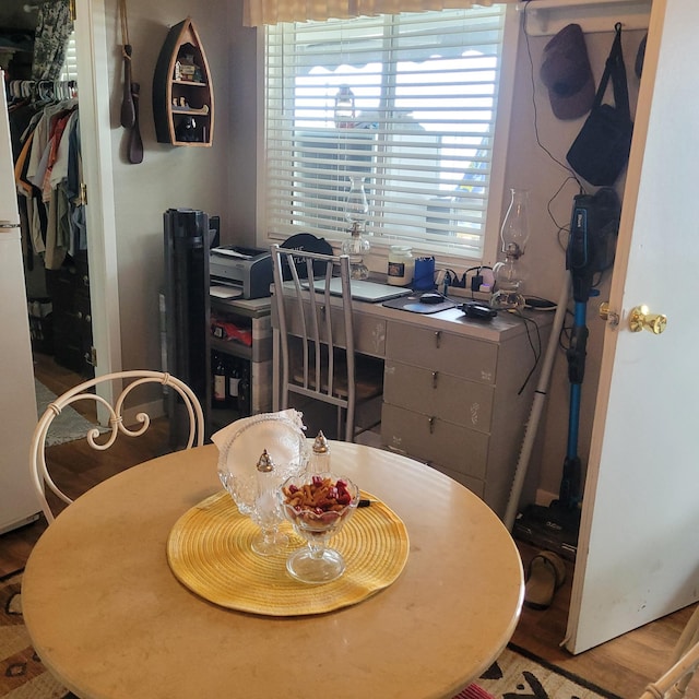 dining space with light hardwood / wood-style flooring