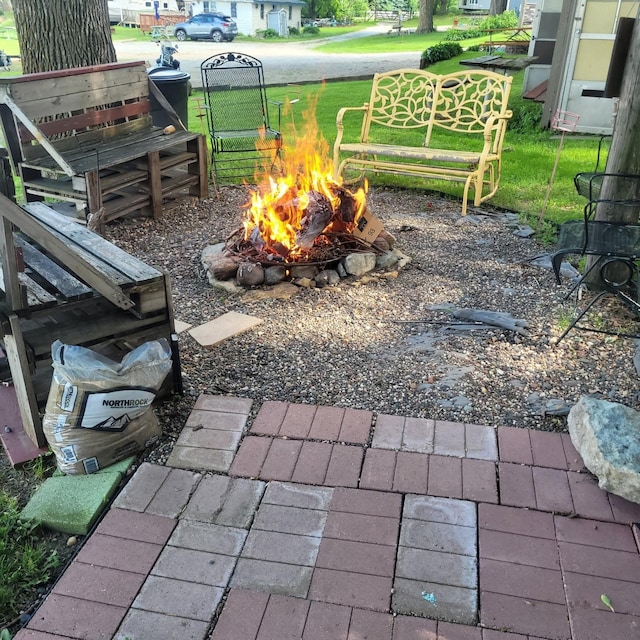 view of patio with an outdoor fire pit