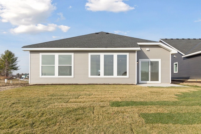 rear view of house with a yard