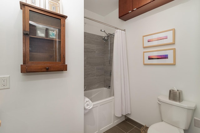 bathroom with toilet, tile patterned floors, and shower / bath combo with shower curtain