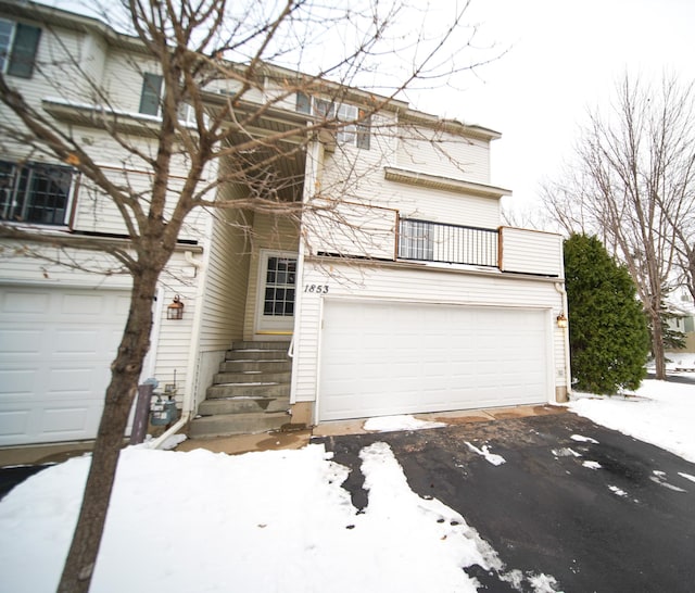 view of front of house with a balcony and a garage