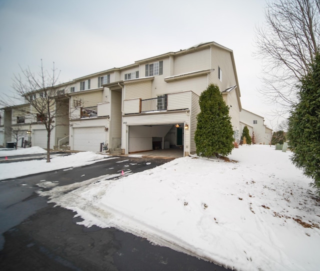 view of front of house with a balcony and a garage