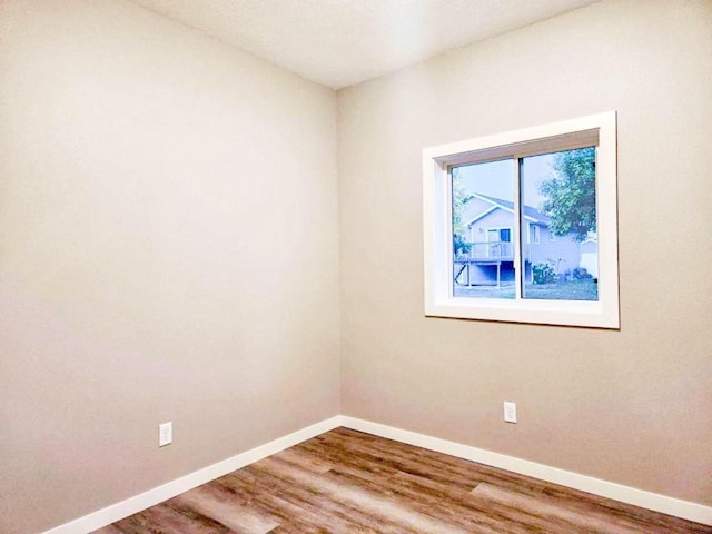 unfurnished room featuring wood-type flooring