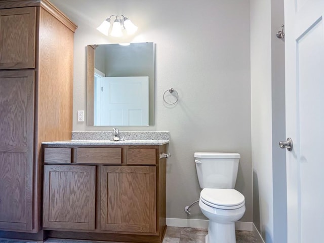 bathroom with tile patterned floors, vanity, and toilet