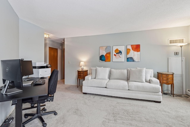 office area with light carpet and a textured ceiling