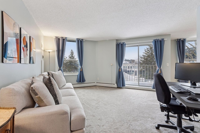 carpeted office with a baseboard heating unit and a textured ceiling